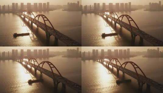 清晨唯美日出下轮船驶过长沙福元路大桥高清在线视频素材下载