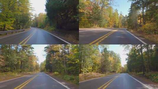 汽车行驶在秋季森林公路上旅行POV第一视角高清在线视频素材下载