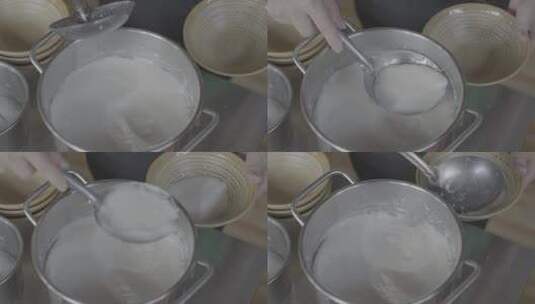 将井水豆腐粥盛进碗中高清在线视频素材下载