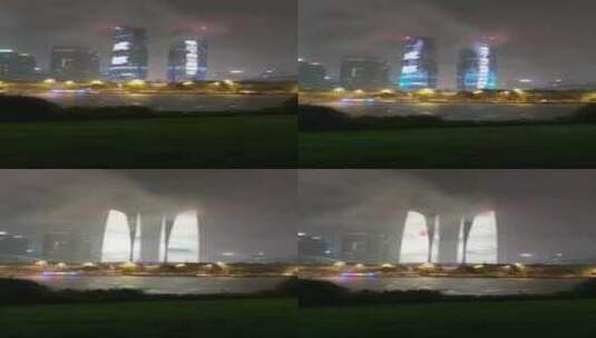 夜晚大雨中的成都金融城双子塔灯光秀高清在线视频素材下载