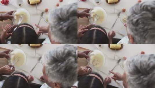一个混血孙女和一个白发祖母正在一起烘焙高清在线视频素材下载