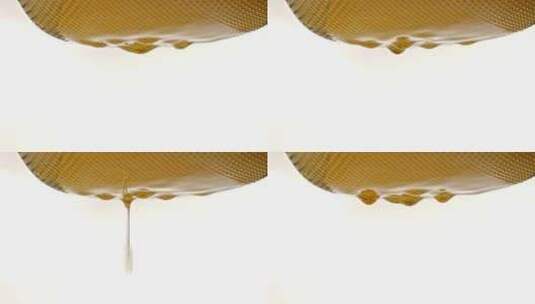 金黄色的食用油液体慢动作掉落高清在线视频素材下载