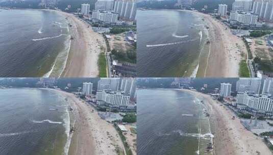 海浪拍打沙滩沙滩游泳游客航拍高清在线视频素材下载