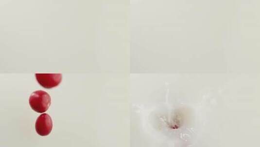 慢镜头拍摄新鲜小番茄落入牛奶创意视频高清在线视频素材下载