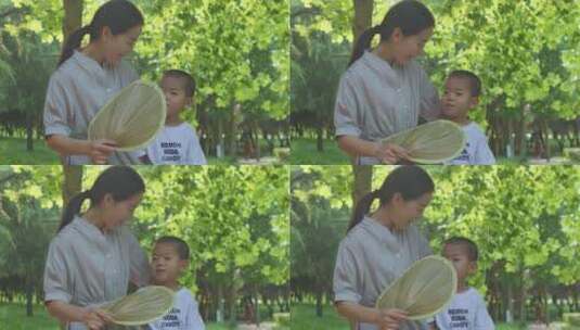中国人女性母子公园乘凉避暑玩耍高清在线视频素材下载