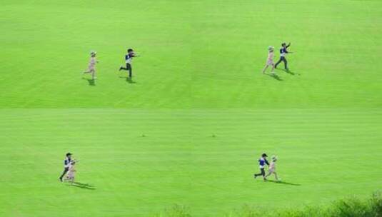 两个小孩在草地上欢快地奔跑高清在线视频素材下载