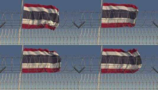 铁丝网后面模糊的泰国国旗高清在线视频素材下载