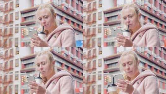 游客在美国纽约唐人街喝奶茶玩手机高清在线视频素材下载