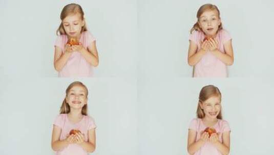 女孩拿着桃子后开心的笑了高清在线视频素材下载