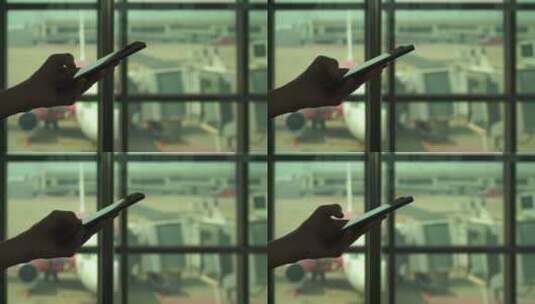 乘客在机场使用手机高清在线视频素材下载