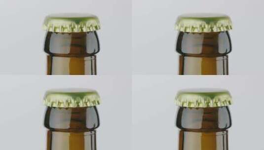 一瓶啤酒的金属瓶盖高清在线视频素材下载