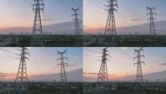 夕阳下的高压电线输电塔航拍高清在线视频素材下载