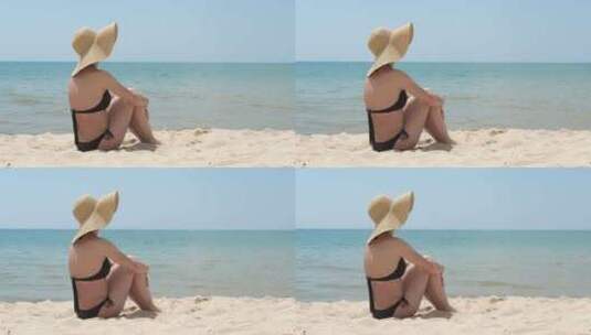 沙滩上的女性日光浴高清在线视频素材下载