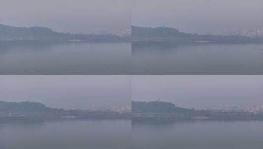 航拍晨雾笼罩下的杭州西湖断桥高清在线视频素材下载