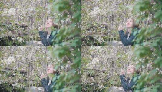樱花灌木丛中的女孩高清在线视频素材下载
