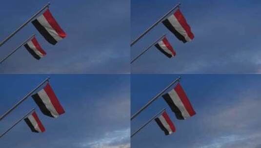 也门国旗在蓝天-4K高清在线视频素材下载