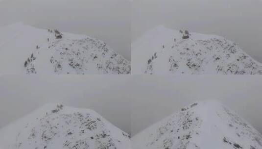 航拍登顶四川贡嘎山区贡巴峰雪山的登山者高清在线视频素材下载