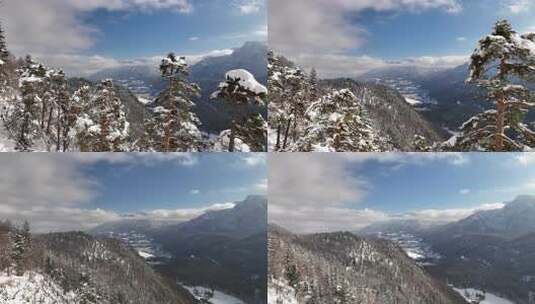 大山中的雪景航拍山脉，松树远山白云！高清在线视频素材下载