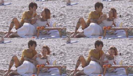 一对情侣在海滩上放松高清在线视频素材下载
