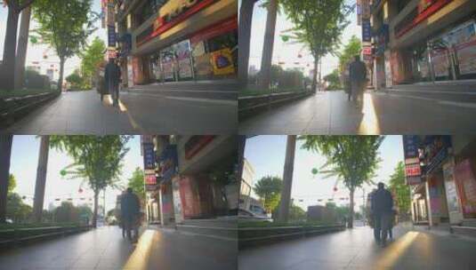 在街道上用推车推纸皮的男人高清在线视频素材下载
