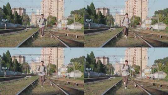 男人在铁轨上奔跑高清在线视频素材下载