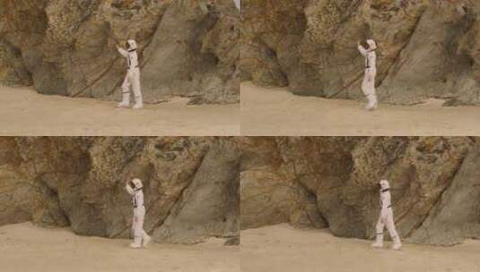 穿着太空服走在沙地上男孩高清在线视频素材下载