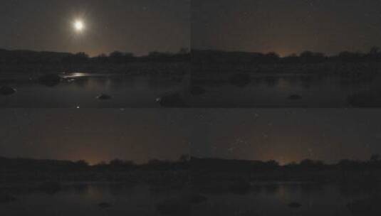 湖泊上方月亮和星星落下景观高清在线视频素材下载