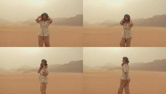 女人在沙漠中步行高清在线视频素材下载
