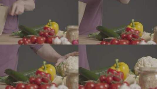跟踪拍摄将蔬菜放在桌子上的人高清在线视频素材下载