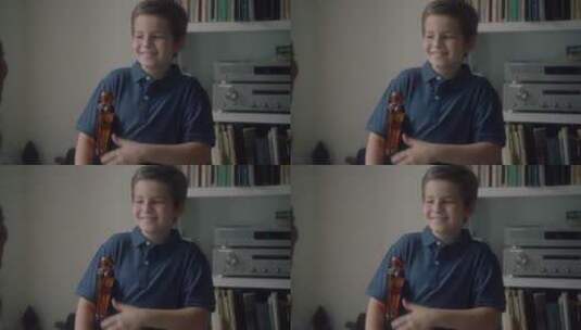 男孩微笑着和音乐老师交流高清在线视频素材下载