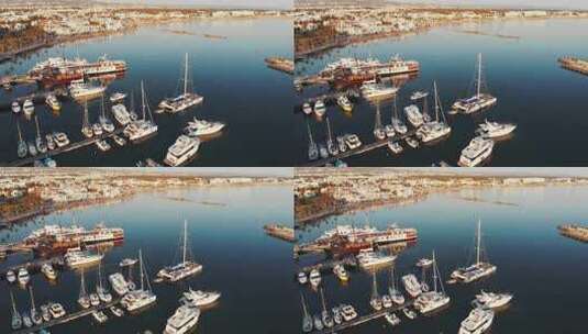 码头和帆船渔夫船和摩托艇漂浮的滨海湾俯视图高清在线视频素材下载