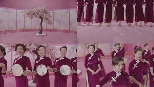 唯美桃树下一群旗袍女持扇团走秀展示好状态高清在线视频素材下载