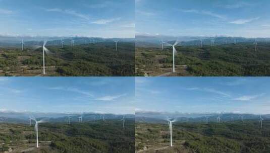 在一个拥有绿色森林和美丽蓝天的风力涡轮机农场上空的超光速拍摄。视差。高清在线视频素材下载