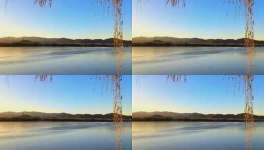 冬季颐和园日落余晖湖面与远山高清在线视频素材下载