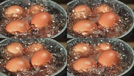 在不锈钢锅中煮沸的鸡蛋，特写镜头。沸水高清在线视频素材下载