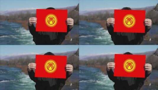手持吉尔吉斯斯坦国旗旗帜的人高清在线视频素材下载