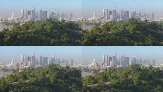 洛杉矶背景下带有高层办公楼的绿色城市公园高清在线视频素材下载