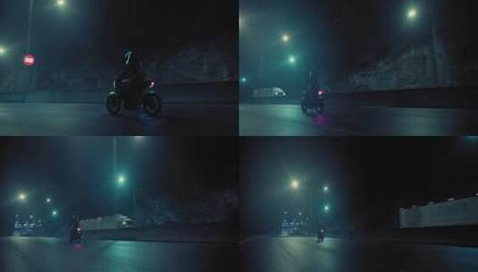 夜间骑行的摩托车手高清在线视频素材下载