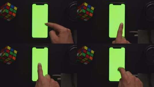 男性在iphone的绿屏上滑动高清在线视频素材下载