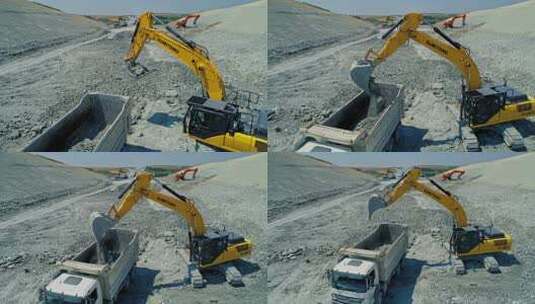 挖掘机将岩石装入卡车高清在线视频素材下载