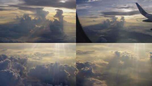 飞机窗外夕阳云层丁达尔傍晚航拍云层空镜高清在线视频素材下载