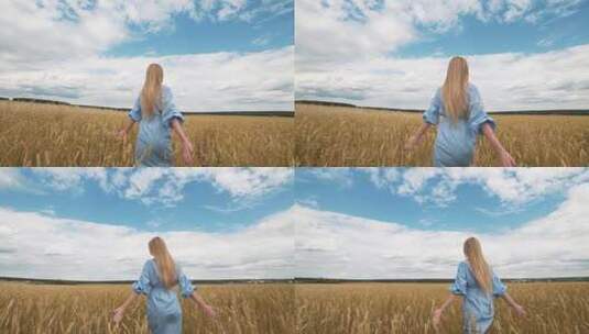 一个穿着蓝色连衣裙的年轻女孩站在田野里，风吹动着她的头发高清在线视频素材下载