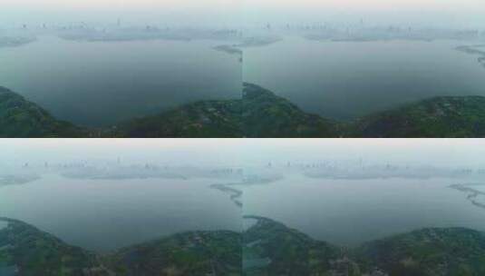 迷雾中的城市和山湖大全景航拍高清在线视频素材下载