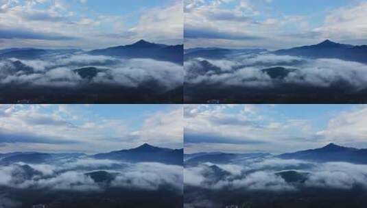航拍云雾缭绕的山川大地高清在线视频素材下载