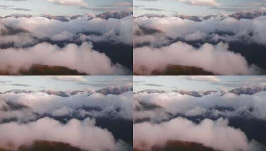 雪山山脉在山谷云层上的景观高清在线视频素材下载