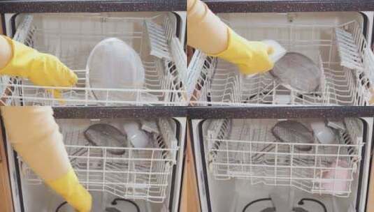 在住宅厨房的洗碗机中清洗盘子高清在线视频素材下载