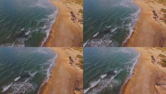 航拍海浪涌向海滩景观高清在线视频素材下载