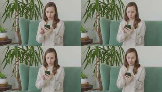 女人坐在沙发上用智能手机高清在线视频素材下载