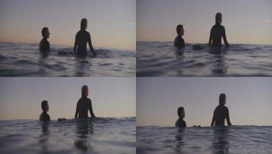一男一女在冲浪板上冲浪高清在线视频素材下载