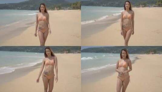走在海滩上的纹身女人高清在线视频素材下载